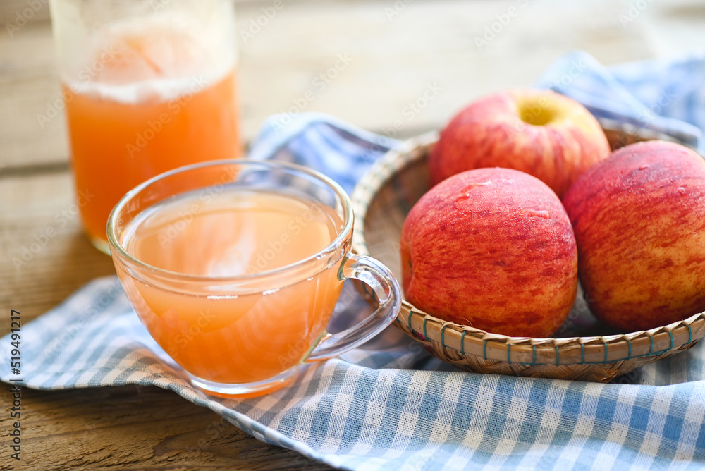 apple cider vinegar natural remedies and cures for common health condition, raw and unfiltered organic apple cider vinegar in glass with apple fruit on basket on the wooden table apple cider vinegar natural remedies and cures for common health condition, raw and unfiltered organic apple cider vinegar in glass with apple fruit on basket on the wooden table