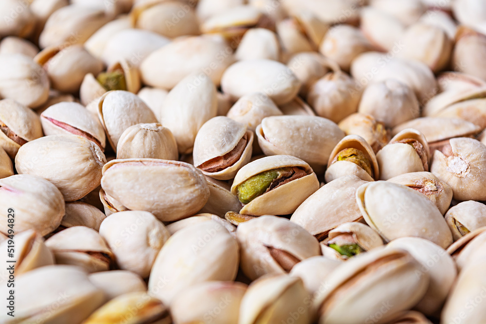 Background of pistachio nuts. Roasted salted pistachios.