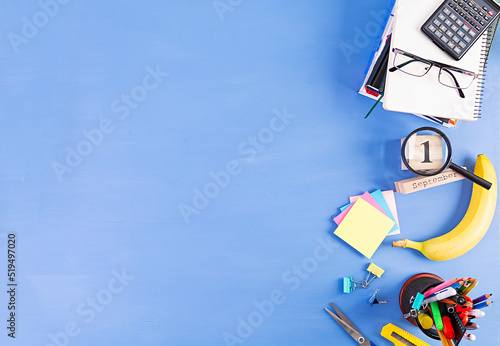 Different school supplies on blue background. Concept Back to school