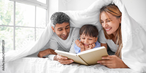 Happy parents reading book ...
