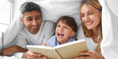 Happy parents reading book ...