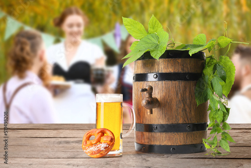 Wooden barrel, mug of fresh...