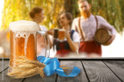 Mug of fresh beer on table ...