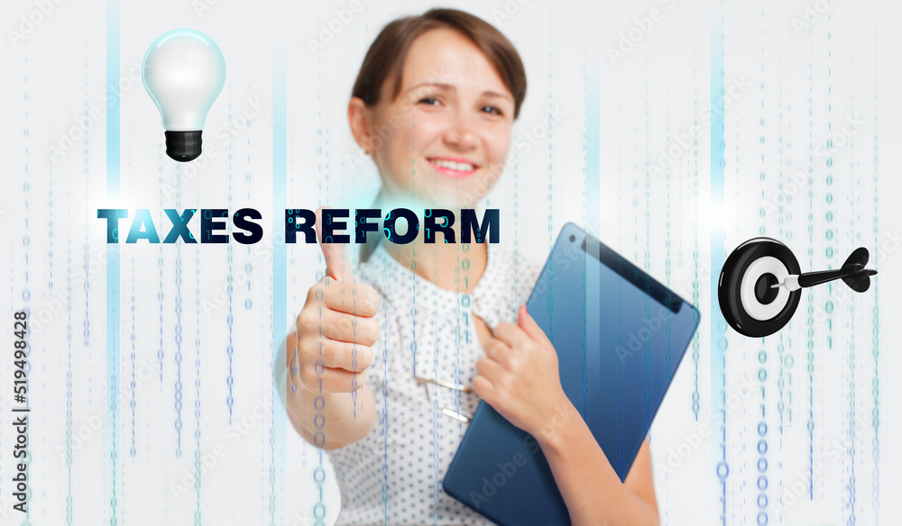Business, Technology, Internet and network concept. Young businessman working on a virtual screen of the future and sees the inscription: Taxes reform Business, Technology, Internet and network concept. Young businessman working on a virtual screen of the future and sees the inscription: Taxes reform