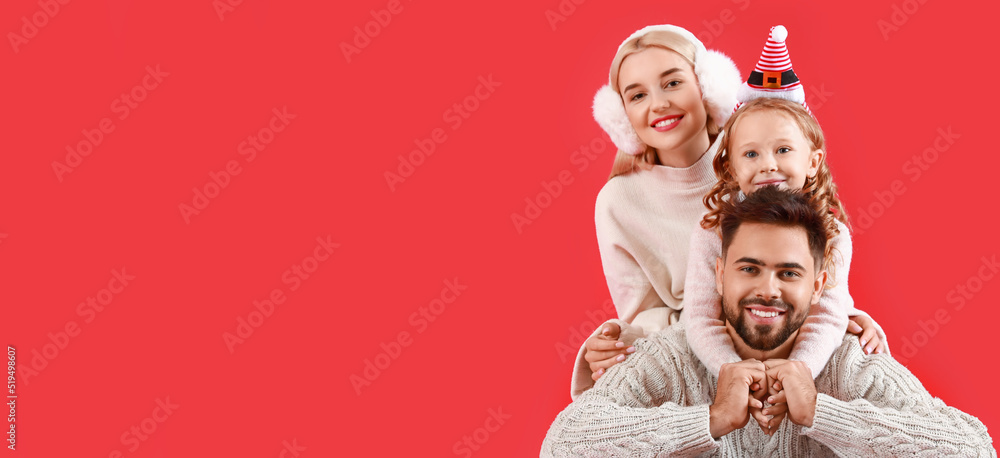 Happy family on red background with space for text. Christmas celebration Happy family on red background with space for text. Christmas celebration