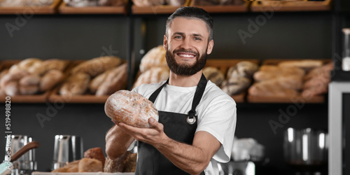 Male baker with fresh bread...