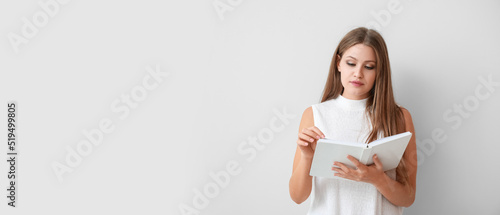 Beautiful young woman readi...