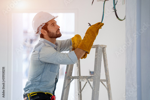 Electrician working on building site,Repairing light at home,repair work.