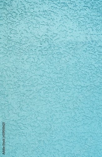 Plaster wall texture background. Rough turquoise blue plaster wall pattern.