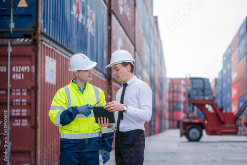 Engineer container cargo with worker working and checking stock into container for loading,logistic and business export,Cargo Shipping Import and Export industry.
