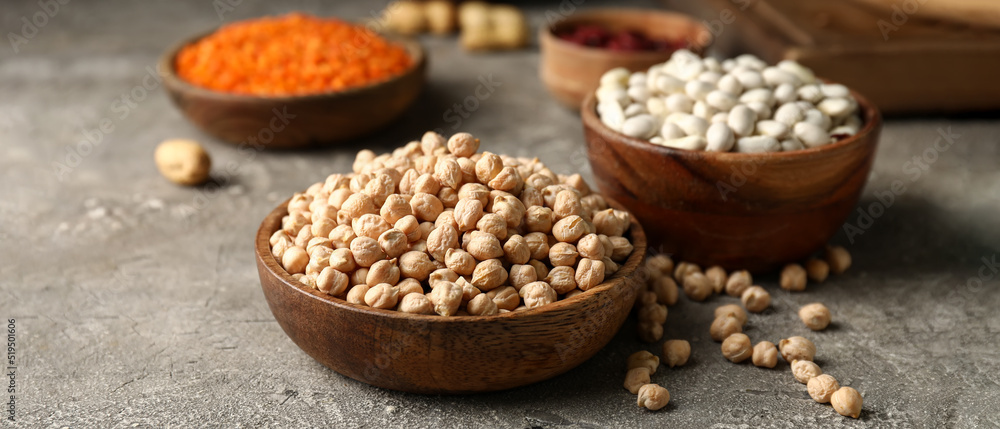 Wooden bowl with dried chickpea on grunge background Wooden bowl with dried chickpea on grunge background