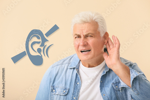 Mature man with hearing pro...
