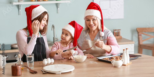 Young woman, her mother and...