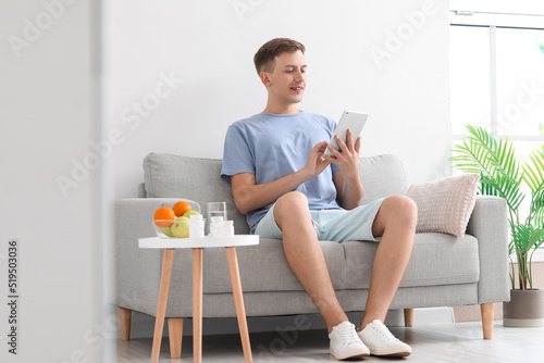 Young man using tablet comp...