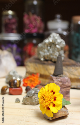 Incense Cone on Stone With Crystals and Flowers. Meditation Table