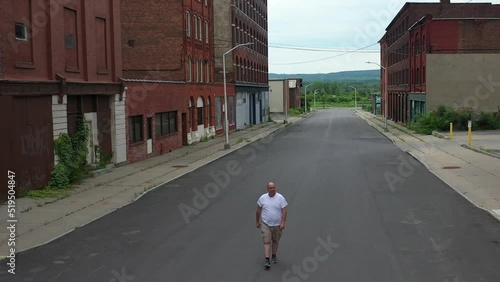 Wallpaper Mural Man walking towards camera on abandoned street 4K Torontodigital.ca