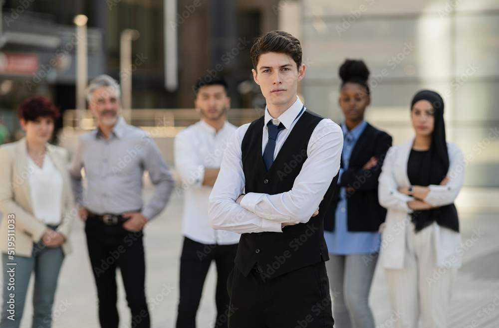 Obraz premium group of multiracial businesspeople standing,multiracial business people standing focus on young Caucasian man