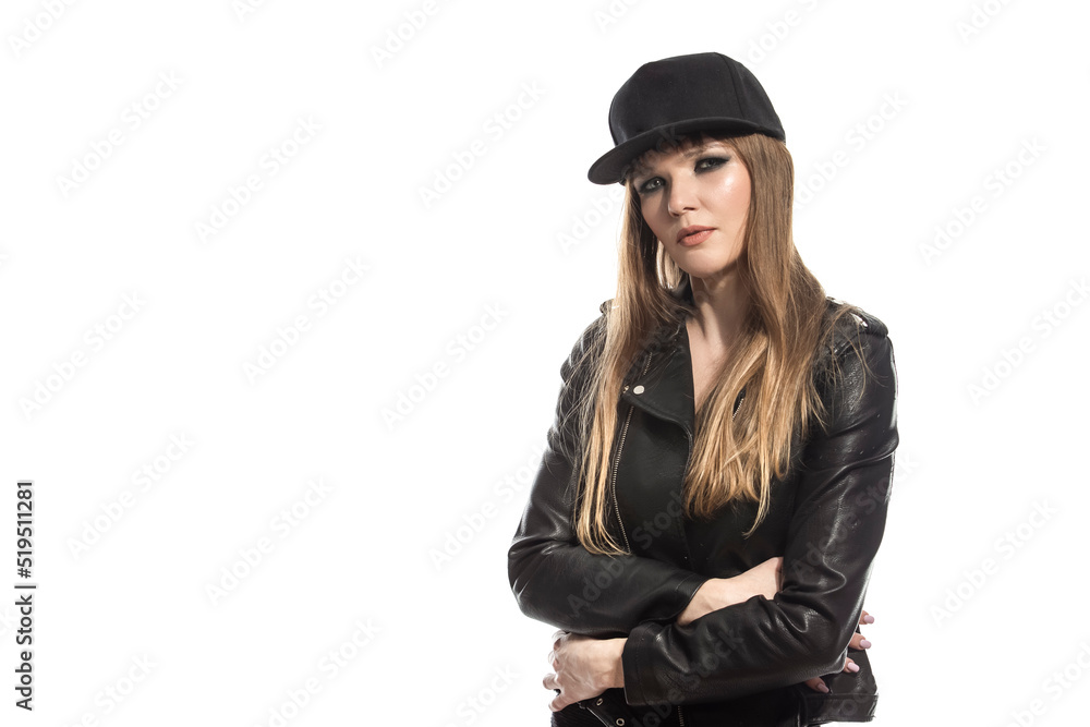 Sporty Caucasian Winsome Blond Sexy Girl in Leather Jacket And Fitness Skinny Outfit While Posing in Black Cap Over Pure White Background. Sporty Caucasian Winsome Blond Sexy Girl in Leather Jacket And Fitness Skinny Outfit While Posing in Black Cap Over Pure White Background.