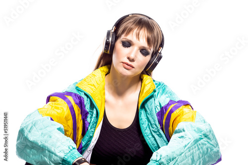 Relaxed Winsome Caucasian Female Athlete Sportwoman in Fitness Sexy Outfit Wearing Wireless Headphones While Listening Music Sitting With Connected Hands photo