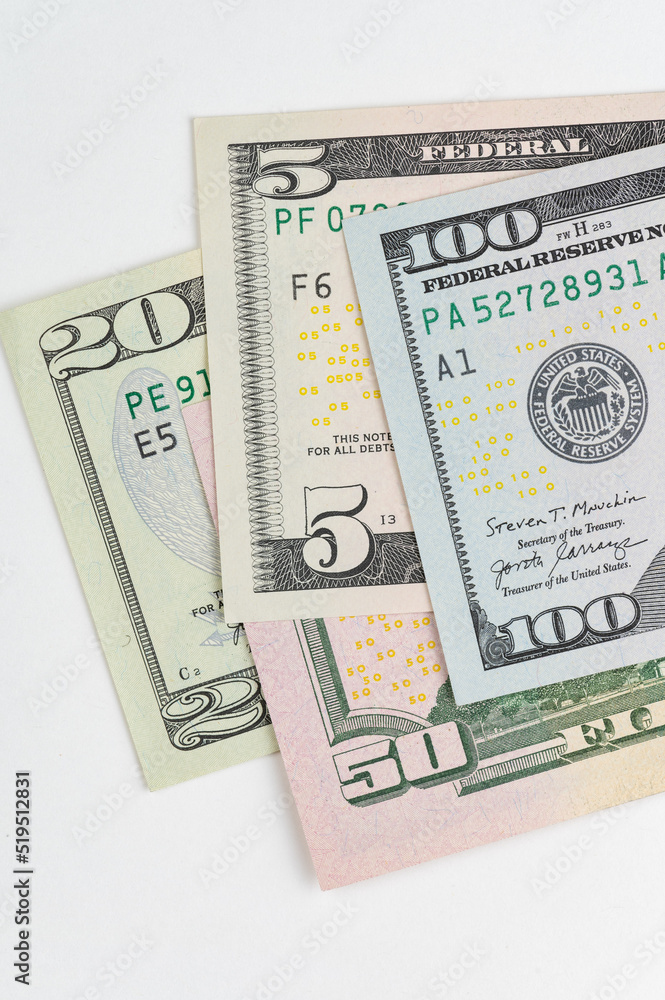 5, 20, 50, 100 dollars banknotes at different angles. Close up of dollars on white background. 5, 20, 50, 100 dollars banknotes at different angles. Close up of dollars on white background.