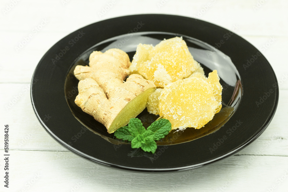 Fresh ginger root and candied ginger in sugar Fresh ginger root and candied ginger in sugar