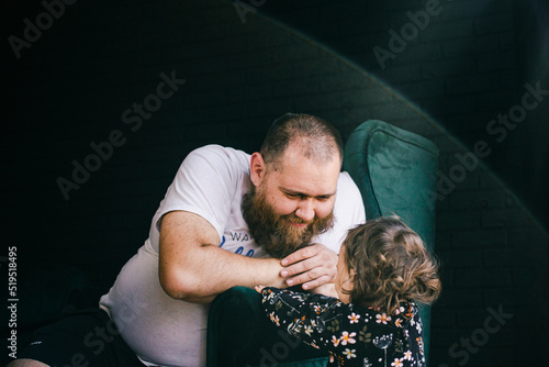 Father and daughter in the room
