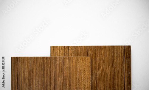Photo of a wooden parquet on a white background. Sale of natural wood flooring. Composite panel in wooden coloring.