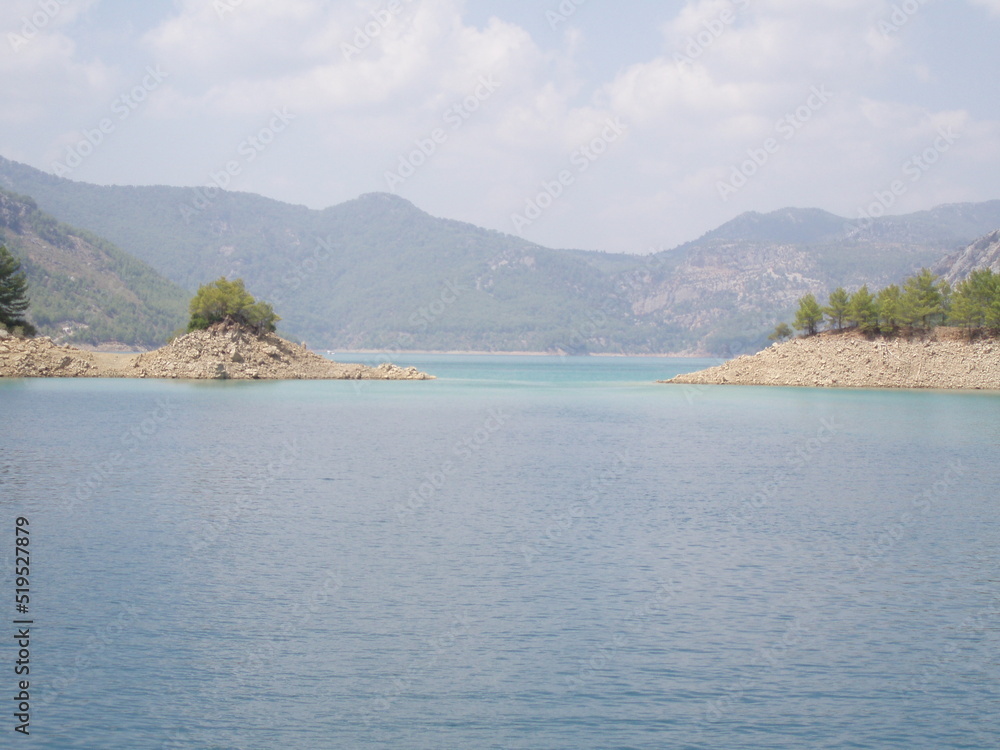 The panoramic view of mountain lake and mountains