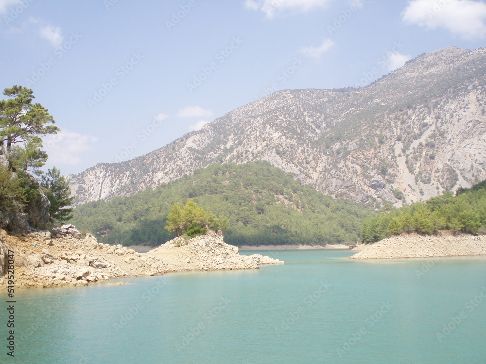 The panoramic view of mountain lake and mountains