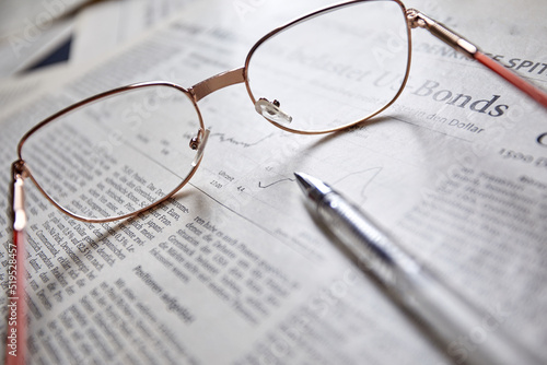 eyeglasses on the newspaper pages