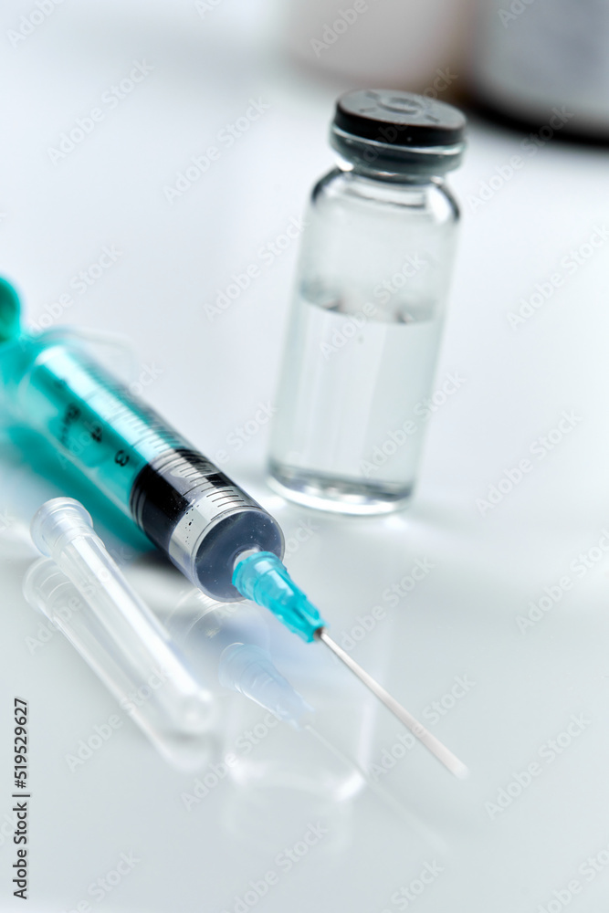 Vaccine in vial with syringe Vaccine in vial with syringe