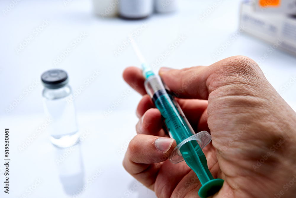 Vaccine in vial with syringe Vaccine in vial with syringe