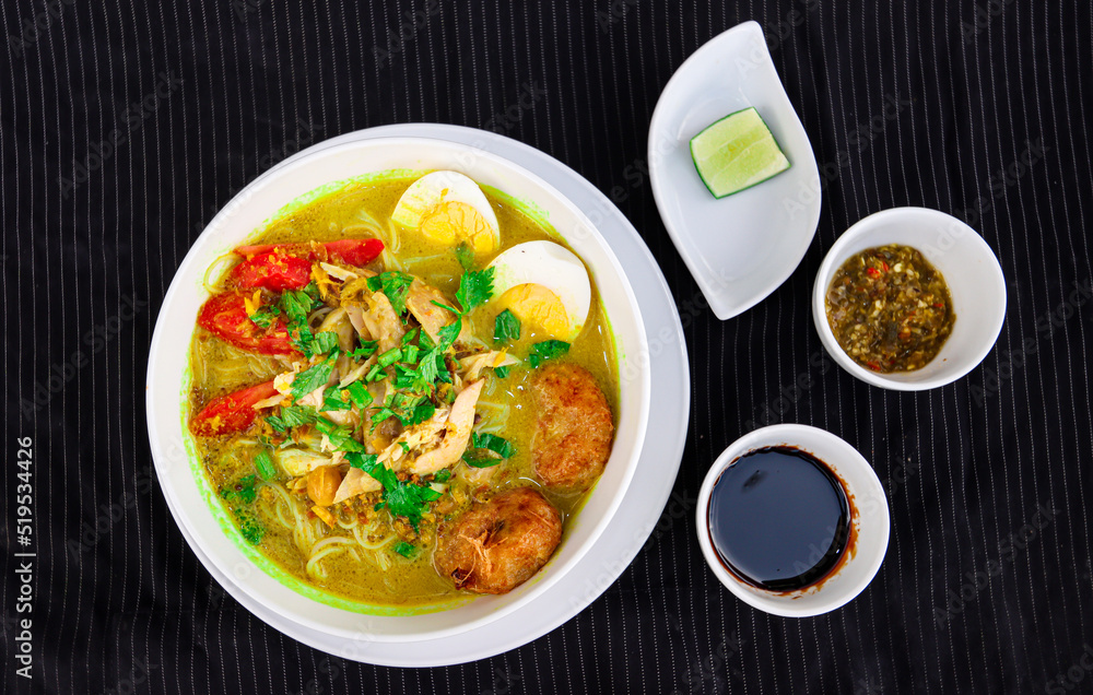 INDONESIAN CULINARY CHICKEN SOUP NOODLE WITH SLICE BOILING EGG AND FRIED MASHED POTATOS AS TOPPING INDONESIAN CULINARY CHICKEN SOUP NOODLE WITH SLICE BOILING EGG AND FRIED MASHED POTATOS AS TOPPING