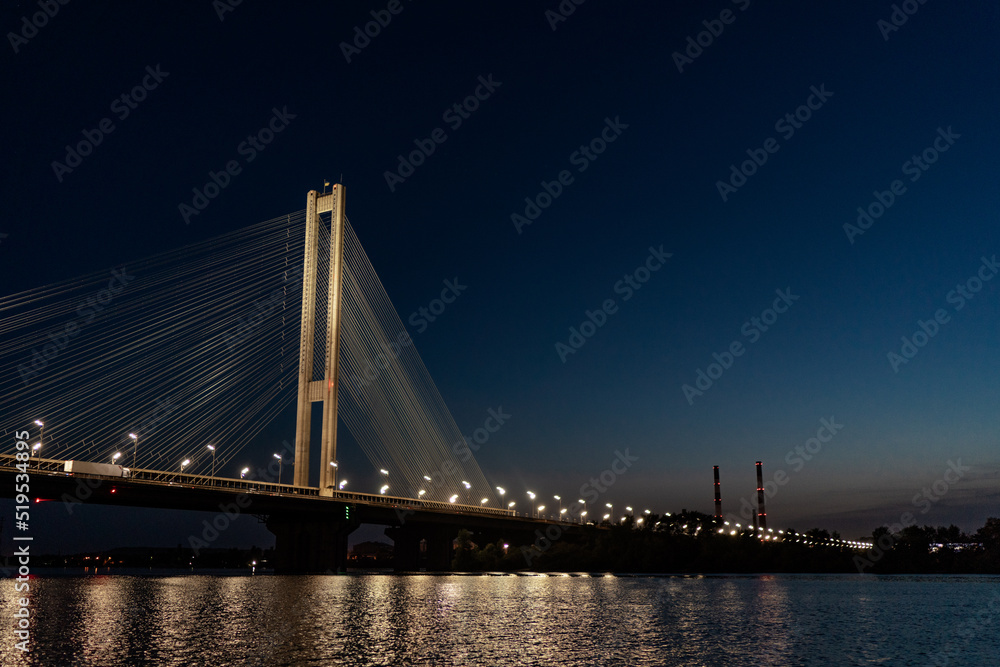 The South bridge at night, Kyiv, Ukraine. Bridge at sunset across the Dnieper River.