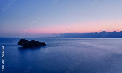 Dusk and dawn landscape. Beautiful Antalya sea bay at sunset evening time.