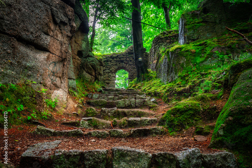 A foggy landscape of stairs from hellish Valley to Chojnik Castle in the Karkonosze Mountains. Poland