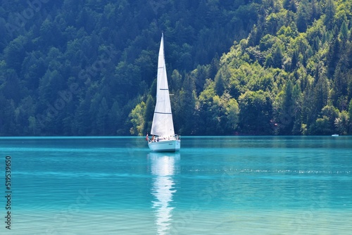 Sailboat on turquoise colored