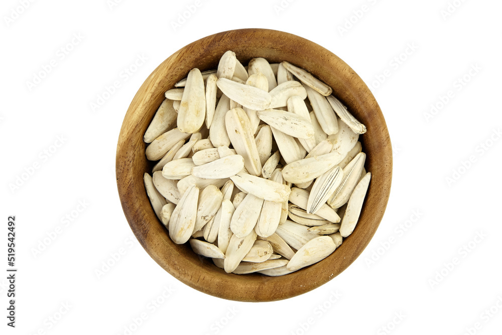 Sunflower seeds in wooden bowl isolated on white Sunflower seeds in wooden bowl isolated on white