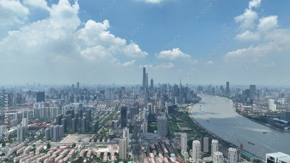Timelapse of Epic Shanghai downtown skyline. Drone aerial view. City landmark buildings, Huangpu river with the cloud moving quickly dramatic mood. Business, economy and travel concept b-roll footage. Timelapse of Epic Shanghai downtown skyline. Drone aerial view. City landmark buildings, Huangpu river with the cloud moving quickly dramatic mood. Business, economy and travel concept b-roll footage.