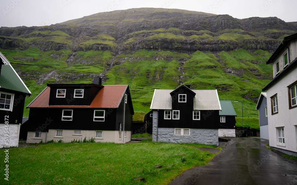 Beautiful view of the Tjornuvik village in the middle of the Mountains in Faroe Island