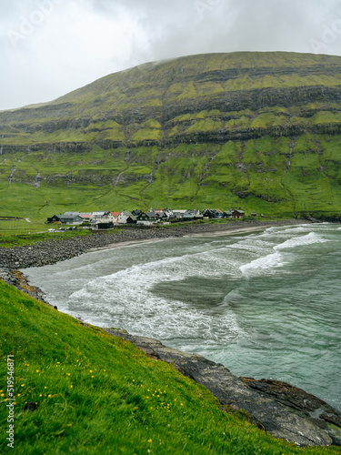 Beautiful view of the Tjornuvik village in the middle of the Mountains in Faroe Island