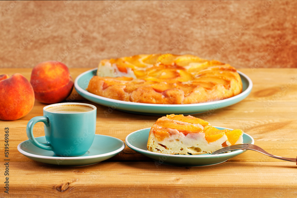 Homemade pie with peaches and cup of coffee espresso on wooden table. Shallow focus. Homemade pie with peaches and cup of coffee espresso on wooden table. Shallow focus.