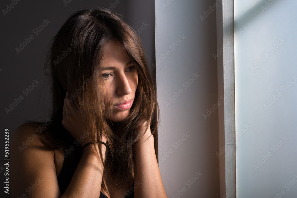 Portrait of sexy slim young woman with long brown hair wearing black top Portrait of sexy slim young woman with long brown hair wearing black top