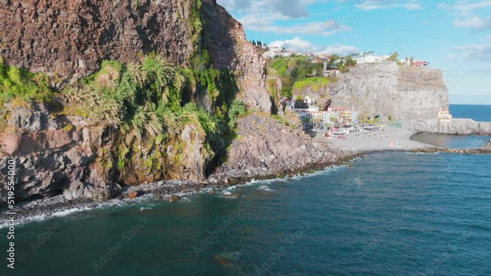 Rugged Cliffs And Coastline Of Ponta do Sol Beach At Summer In Madeira, Portugal. - aerial Rugged Cliffs And Coastline Of Ponta do Sol Beach At Summer In Madeira, Portugal. - aerial