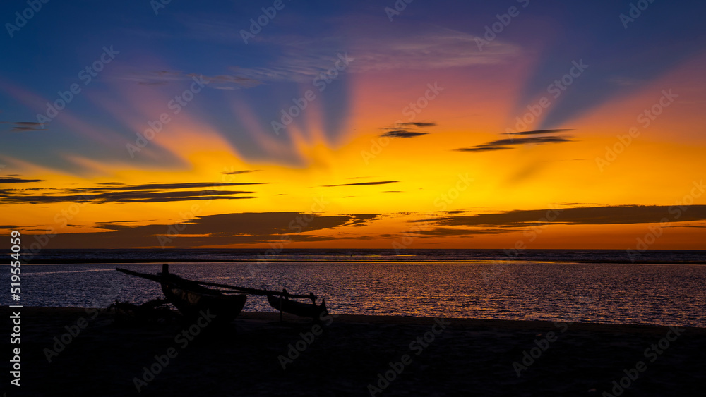 Sunset and sunrays with dramatic sky over Ocean , Madagascar Sunset and sunrays with dramatic sky over Ocean , Madagascar