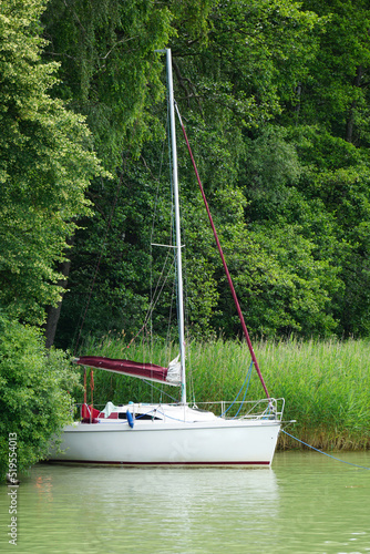 Fototapeta Naklejka Na Ścianę i Meble -  Sailboat moored at shore - Masuria, Poland