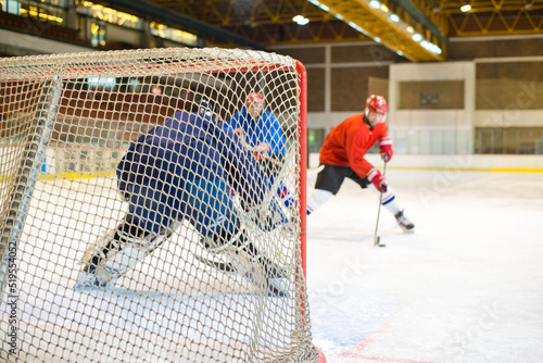 Canvas Print Ice hockey players playing ice hockey in the ice rink in winter