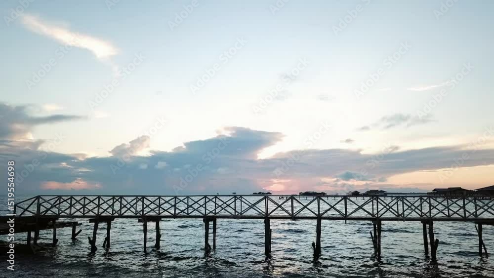 Wooden jetty in Semporna during sunrise in Sabah, Malaysia. Wooden jetty in Semporna during sunrise in Sabah, Malaysia.