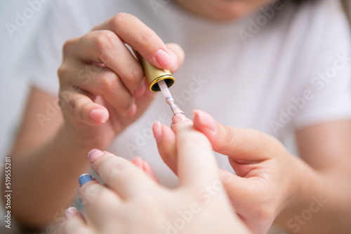 Nail Care And Manicure. Closeup Of Beautiful Female Hands Applying Nail Polish On Healthy Natural Woman s Nails In Beauty Salon.