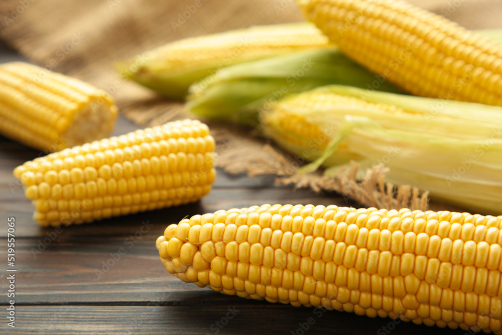 Fresh corn on cobs on rustic wooden table, closeup Fresh corn on cobs on rustic wooden table, closeup